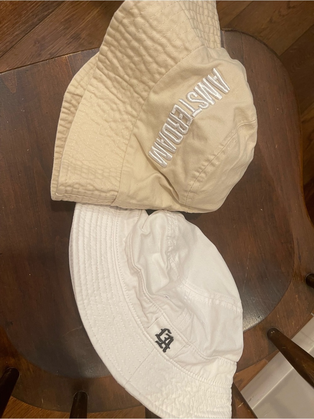2 bucket hats one LA another one Amsterdam